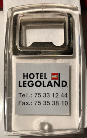 Bottle Opener with 'Hotel Legoland' Logo and Phone Numbers Pattern