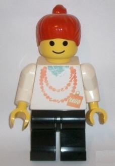 Display Figure 7in x 11in x 19in (Female - white shirt with necklace, black legs, red ponytail)