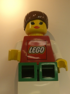 Display Figure 7in x 11in x 19in (Female - red shirt with Lego Logo, green legs, brown ponytail)