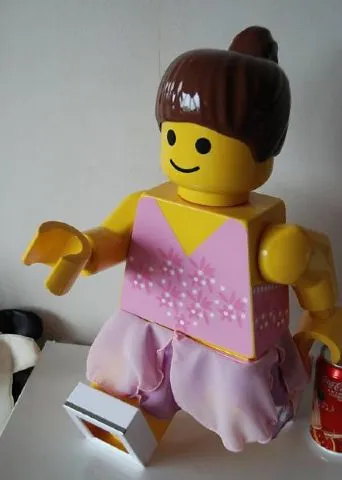Display Figure 7in x 11in x 19in (Female - pink skirt, brown ponytail)