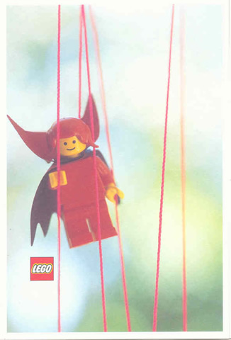Postcard - Lego Art Project 2002 - 022 - Red Minifigure Hanging onto Strings