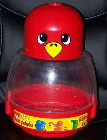 Primo Storage Bird with Red Bottom and Red Top with Eyes and Yellow Beak Pattern