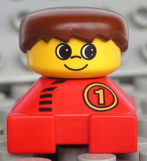 Duplo 2 x 2 x 2 Figure Brick, Red Base With Number 1 Race Pattern, Yellow Head, Brown Male Hair