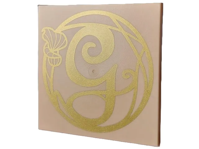 Tile 6 x 6 with Bottom Tubes, Textured Surface with Gold Script Capital Letter G (Glinda) and Flower Pattern