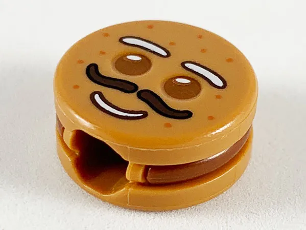 Minifigure, Head, Modified Cookie Shape with Reddish Brown Eyes and Frosting, White Eyebrows and Mouth, Dark Brown Moustache Pattern (Gingerbread Man)