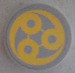 Tile, Round 2 x 2 with Bottom Stud Holder with Yellow Swirl SW Ado Eemon Emblem Pattern (Sticker) - Set 75042
