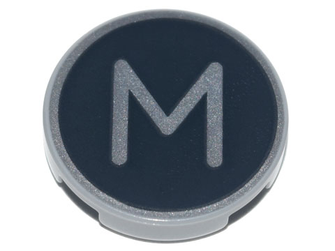 Tile, Round 2 x 2 with Bottom Stud Holder with Silver Capital Letter M on Black Background Pattern