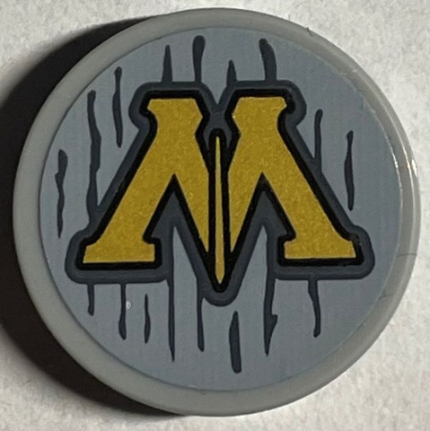 Tile, Round 2 x 2 with Bottom Stud Holder with Gold Capital Letter M (Ministry of Magic Logo) and Dark Bluish Gray Lines Pattern (Sticker) - Set 76403