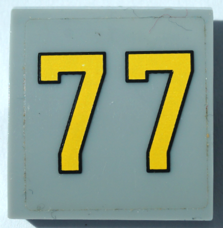 Slope, Curved 2 x 2 x 2/3 with Yellow Number 77 Pattern (Sticker) - Set 76037