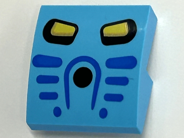 Slope, Curved 2 x 2 x 2/3 with Takua Mask and Yellow Eyes Pattern