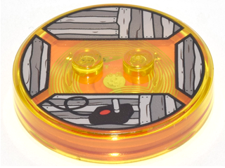 Dimensions Toy Tag 4 x 4 x 2/3 with 2 Studs and Trans-Orange Bottom with Black Video Game Joystick on Dark Bluish Gray and Light Bluish Gray Wood Boards Background Pattern (Jake the Dog)