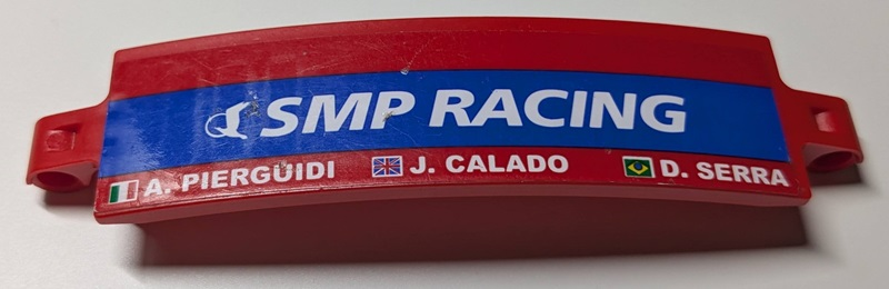 Technic, Panel Curved 3 x 13 with White 'SMP RACING' on Blue Stripe, 'A. PIERGUIDI', 'J. CALADO', 'D. SERRA', Italian, United Kingdom Union Jack and Brazilian Flags Pattern Model Left Side (Sticker) - Set 42125