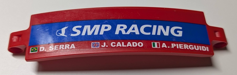 Technic, Panel Curved 3 x 13 with White 'SMP RACING' on Blue Stripe, 'A. PIERGUIDI', 'J. CALADO', 'D. SERRA', Italian, United Kingdom Union Jack and Brazilian Flags Pattern Model Right Side (Sticker) - Set 42125