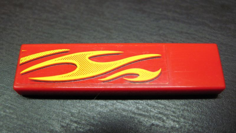 Tile 1 x 4 with Yellow Flames Pattern Model Front Right Side (Sticker) - Set 8667