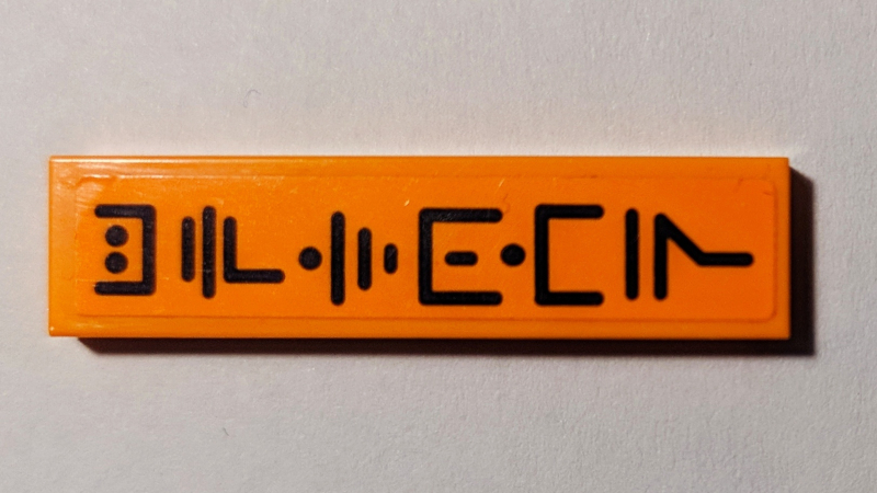 Tile 1 x 4 with Black Ninjago Logogram 'UPTOWN' on Orange Background Pattern (Sticker) - Set 70607