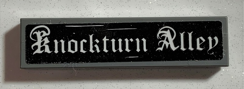 Tile 1 x 4 with White 'Knockturn Alley' on Black Background Pattern (Sticker) - Set 75978
