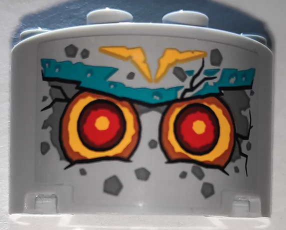 Cylinder Half 2 x 4 x 2 with 1 x 2 Cutout with Stone Face with Red Eyes and Dark Turquoise Eyebrows Pattern (Sticker) - Set 71747