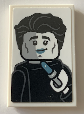 Tile 2 x 3 with Black and White Minifigure, Metallic Light Blue Lipstick Pattern (Sticker) - Set 21319