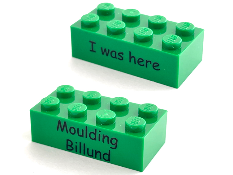 Brick 2 x 4 with Kornmarken Factory Tour Black 'I was here' and 'Moulding Billund' Pattern on Opposite Sides