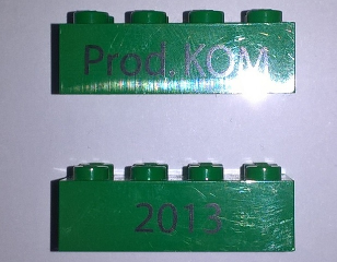Brick 2 x 4 with Black '2013' and 'Prod. KOM' Pattern on Opposite Sides (Kornmarken Factory Tour)