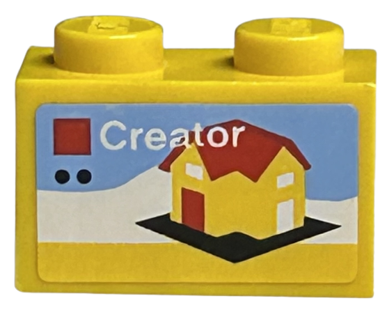 Brick 1 x 2 with LEGO Creator Set Box Art, Yellow House with Red Roof and Door on Black Baseplate Pattern (Sticker) - Sets 40145 / 40305 and Gear 40359