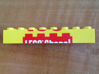 Brick 2 x 8 with Top Half of 'LEGO Store!' Pattern
