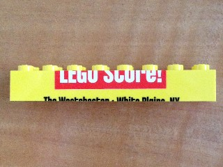 Brick 2 x 8 with Bottom Half of 'LEGO Store!' Pattern