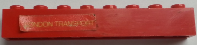 Brick 1 x 8 with Yellow 'LONDON TRANSPORT' Text on Red Background Pattern Model Left Side (Sticker) - Sets 384 / 760-2