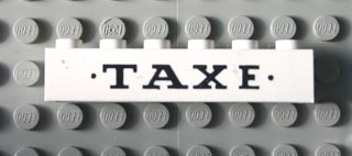 Brick 1 x 6 with Black 'TAXE' and Dots Small Pattern