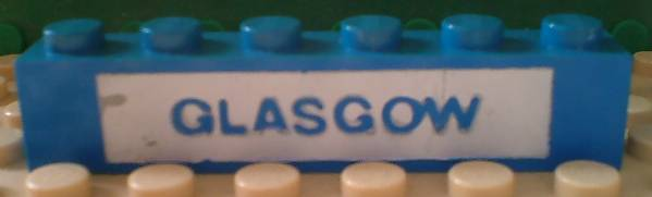 Brick 1 x 6 with Blue in White 'GLASGOW' Pattern