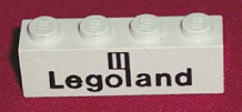Brick 1 x 4 with Black Legoland Logo Pattern