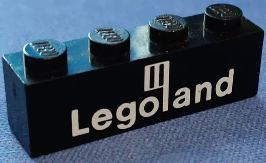 Brick 1 x 4 with White Legoland Logo Pattern