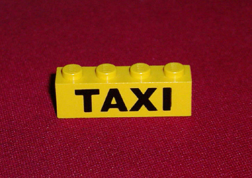 Brick 1 x 4 with Black 'TAXI' Pattern