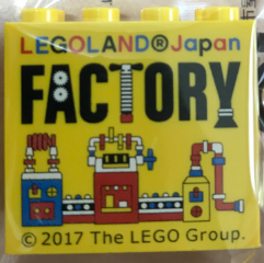 Brick 2 x 4 x 3 with LEGOLAND Japan, Black 'FACTORY', and Blue, Red, and White Machine Pattern