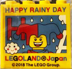 Brick 2 x 4 x 3 with LEGOLAND Japan, 'HAPPY RAINY DAY', Jester Minifigure, and Red Capital Letter H Pattern