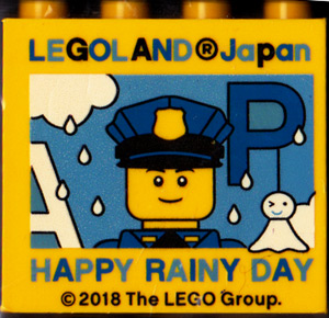 Brick 2 x 4 x 3 with LEGOLAND Japan, 'HAPPY RAINY DAY', Policeman Minifigure, and Blue Capital Letter P Pattern