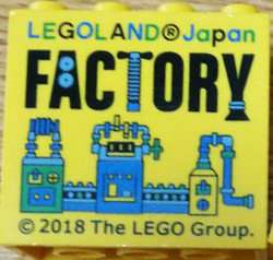 Brick 2 x 4 x 3 with LEGOLAND Japan, Black 'FACTORY', and Green, Blue, and Medium Blue Machine Pattern