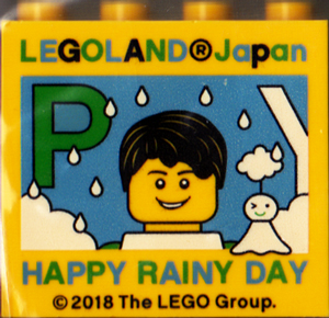 Brick 2 x 4 x 3 with LEGOLAND Japan, 'HAPPY RAINY DAY', Male Minifigure, and Green Capital Letter P Pattern
