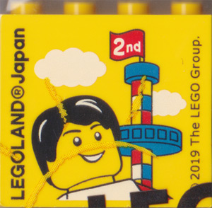 Brick 2 x 4 x 3 with LEGOLAND Japan, '2nd' on Flag, and Male Minifigure Pattern
