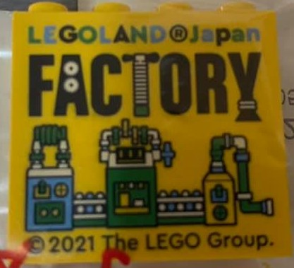 Brick 2 x 4 x 3 with LEGOLAND Japan, Black 'FACTORY', and Medium Blue, Green, and White Machine Pattern