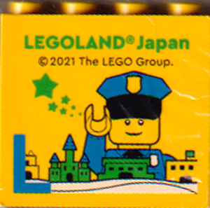 Brick 2 x 4 x 3 with LEGOLAND Japan, Policeman Minifigure (Mr. Cop), Skyline, and Blue Capital Letter L Pattern