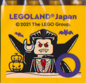 Brick 2 x 4 x 3 with LEGOLAND Japan, Vampire Minifigure, Bats, Jack O' Lanterns, and Dark Purple Capital Letter O Pattern