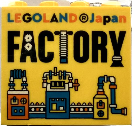 Brick 2 x 4 x 3 with LEGOLAND Japan, Black 'FACTORY', and Orange, Blue, and White Machine Pattern