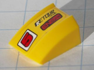 Slope, Curved 2 x 2 Lip with Red '5' and Black 'RETOUR' and Red 'ENgyne' Pattern Model Left side (Sticker) - Set 8122