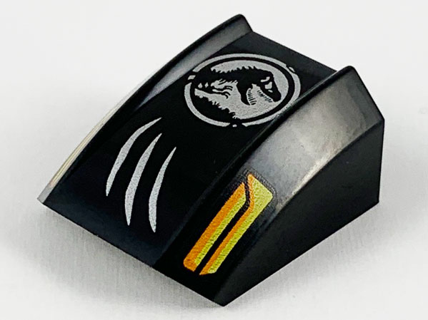 Slope, Curved 2 x 2 Lip with Orange and Yellow Headlights, Silver Scratches and Jurassic World Logo Pattern