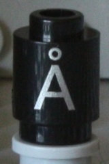 Brick, Round 1 x 1 with Silver Capital Letter A with Ring (Å) Pattern on Both Sides