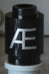 Brick, Round 1 x 1 with Silver Capital Letter Æ Pattern on Both Sides