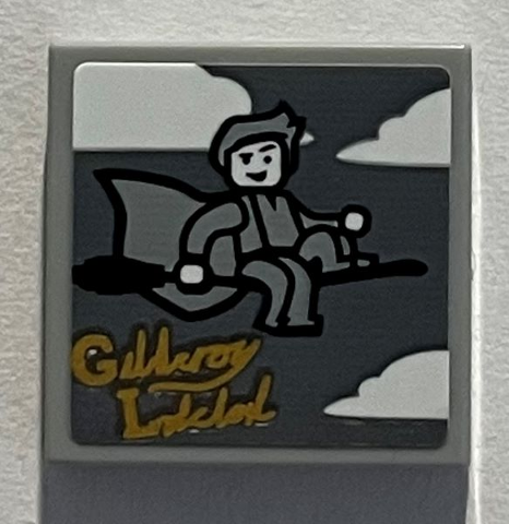 Tile 2 x 2 with Clouds, Minifigure on Broom, Gold Script 'Gilderoy Lockhart' Pattern (Sticker) - Set 76389