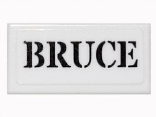 Tile 1 x 2 with Black Stencil 'BRUCE' Pattern (Sticker) - Set 76052