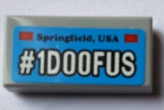 Tile 1 x 2 with 'Springfield, USA' and White '#1D00FUS' Pattern (Sticker) - Set 71016